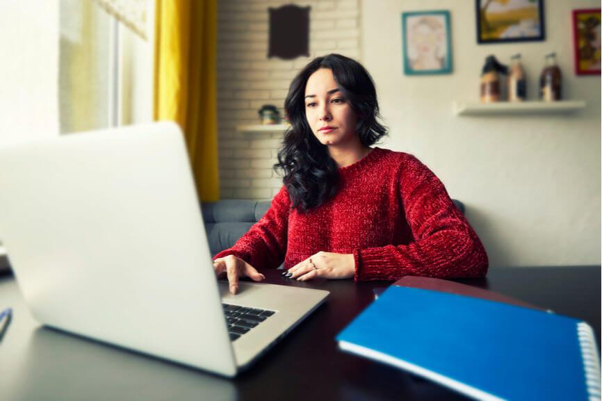 focused woman on computer