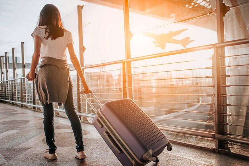 Woman carrying luggage at the airport