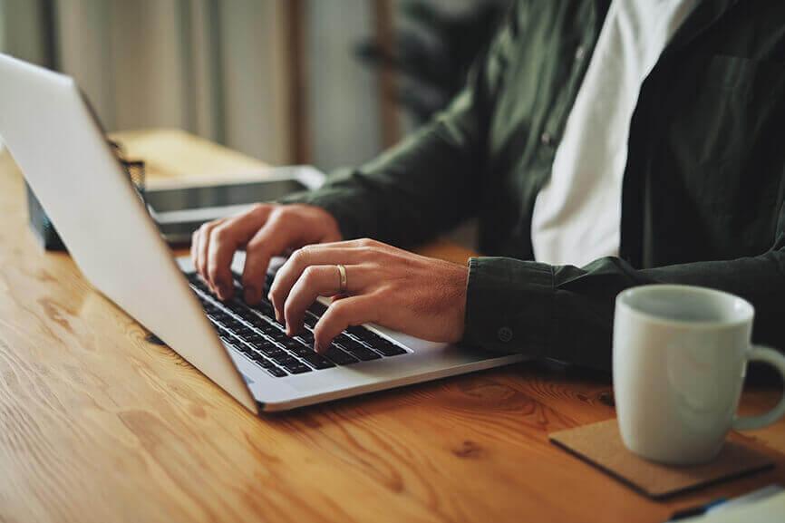 Man typing on laptop