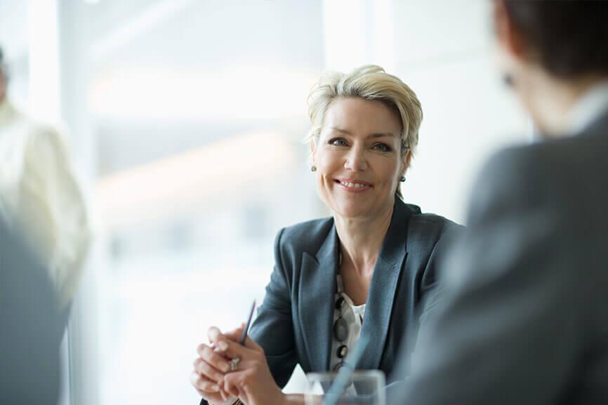 Older woman smiling at work