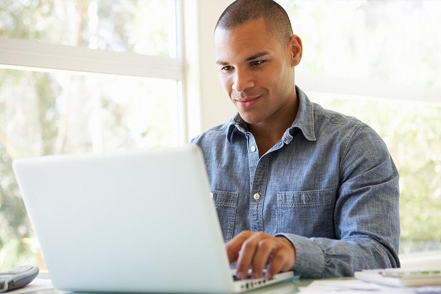 Man typing on laptop