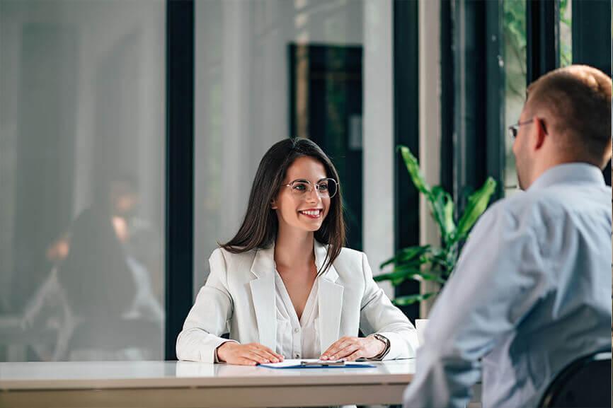 Two people talking in office