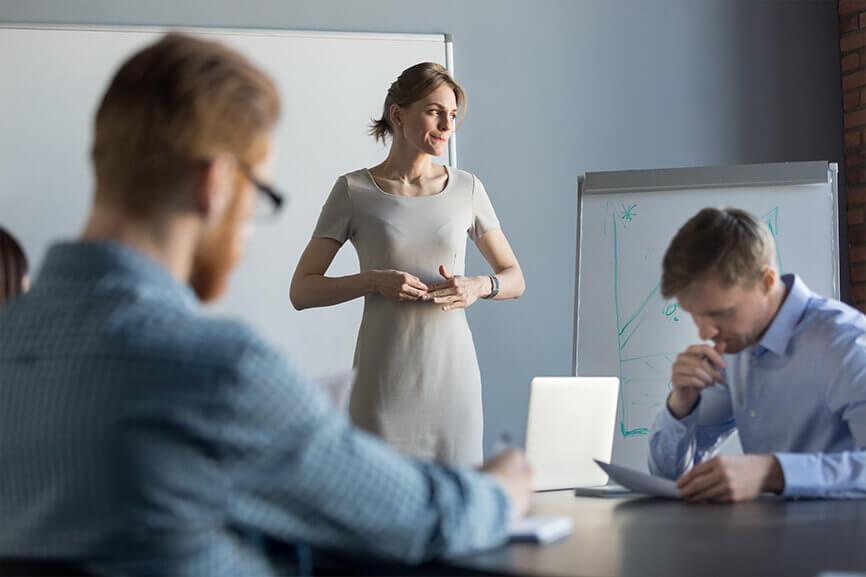 Woman who looks worried, leading meeting looking over at the distance