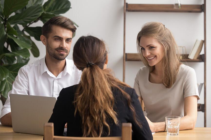 Woman being interviewed by two interviewers