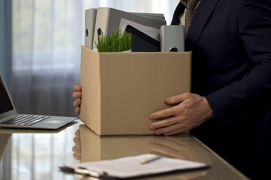 Person holding a box of their office stuff