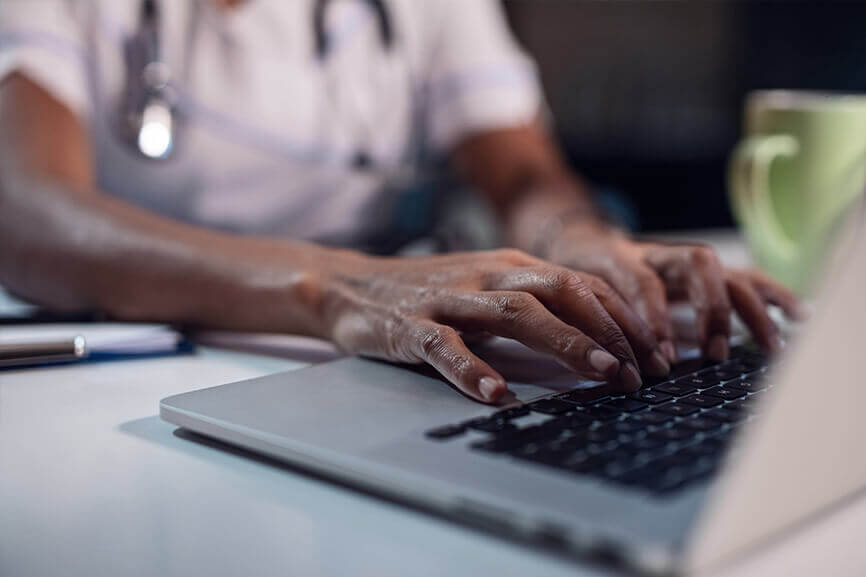 Person typing on laptop