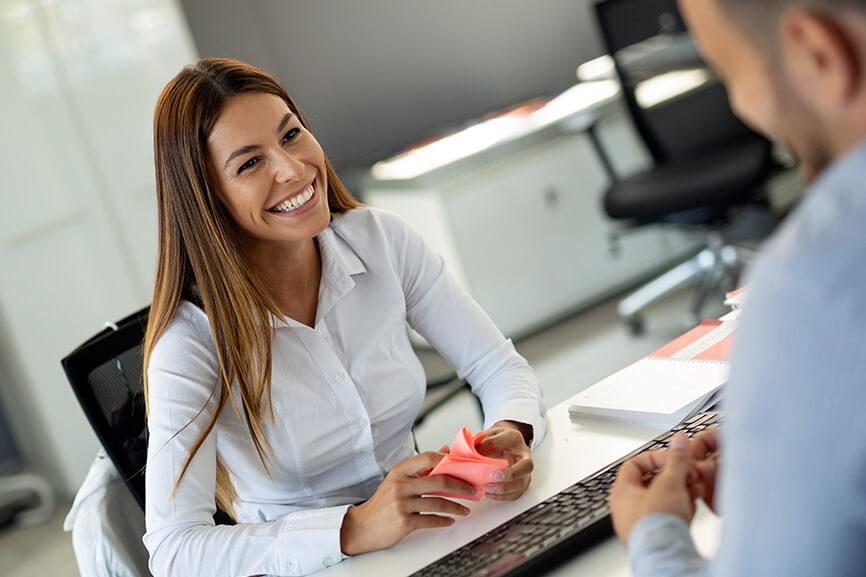 Woman talking to her male coworker