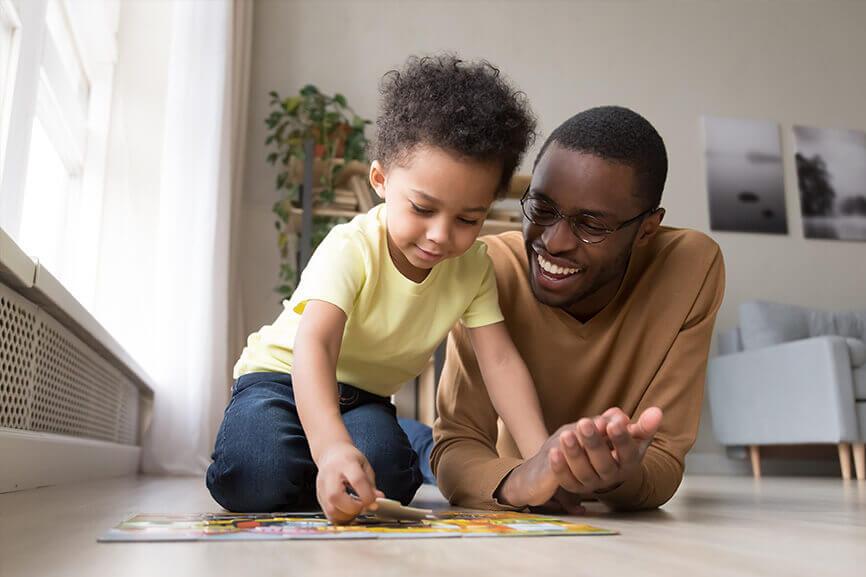 Man spending time with son at home