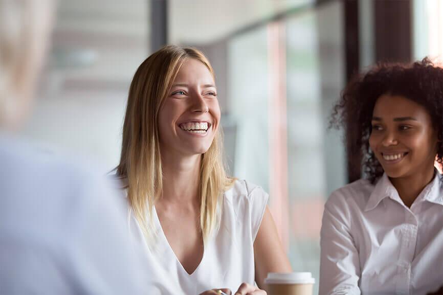 Young woman smiling during a meeting